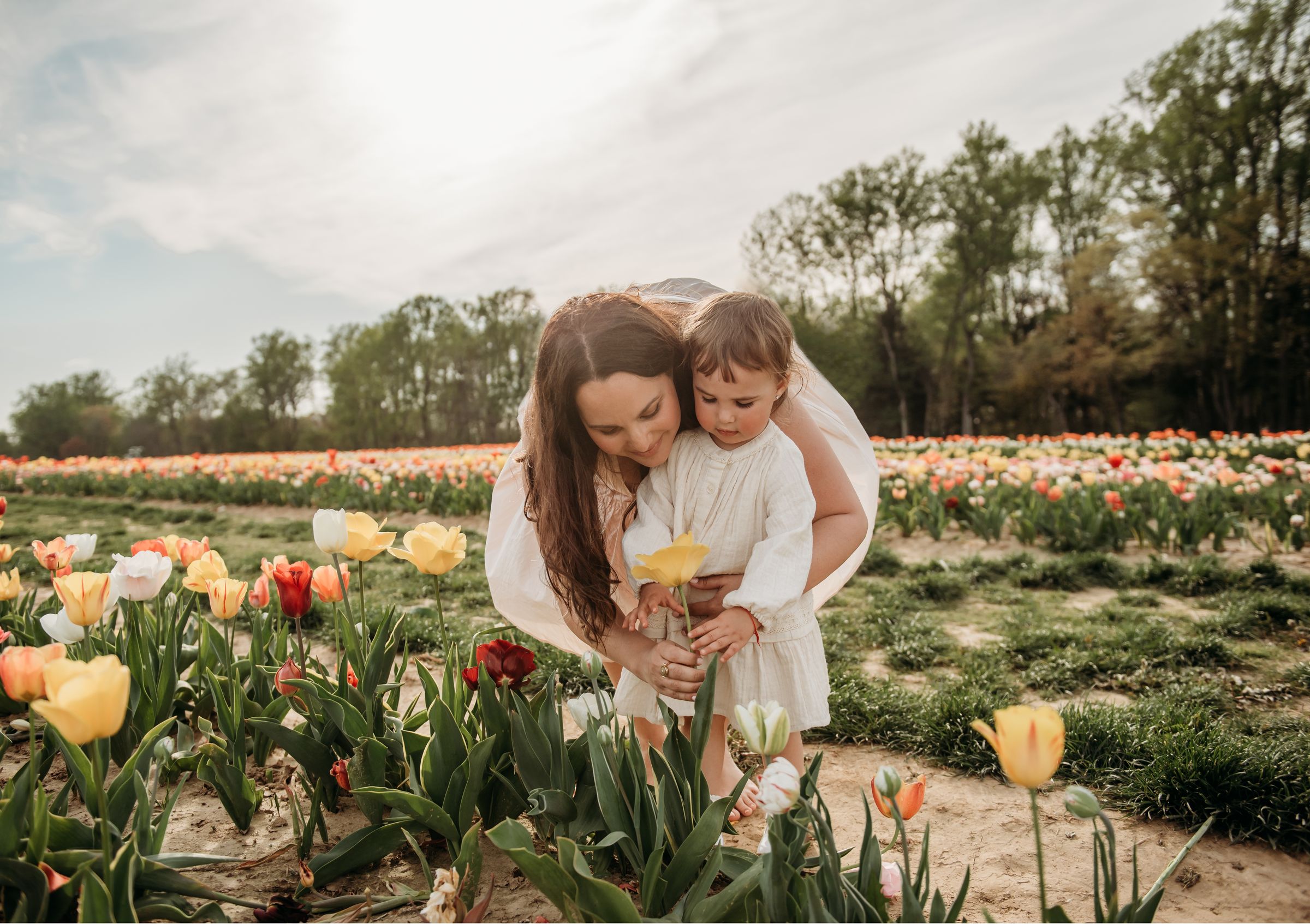 Annetta Fooks with her daughter in a tulip field